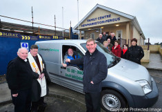 Fr Tom Fitzpartrick presents Hugh Tuohy, chairperson of Meals on Wheels, with the key to a new van at the Newmarket On Fergus Family Centre. Also pictured are Pat Cronin, manager of Obair Newmarket On Fergus, Canon Reuben Butler and members of the Obair organisation. Photograph by Declan Monaghan